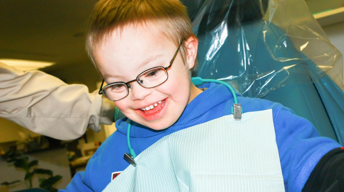 Cute boy who has special needs has a dental appointment