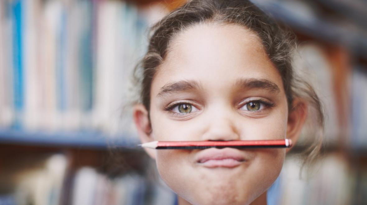 Kid-with-pencil-under-her-nose