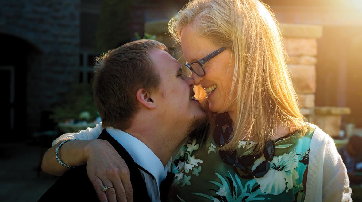 mother and teen son smiling nose to nose