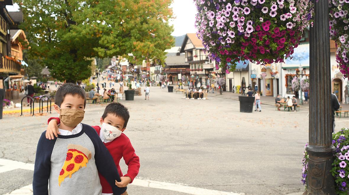 boys on closed street in Leavenworth Washington perfect fall getaway for Seattle area families
