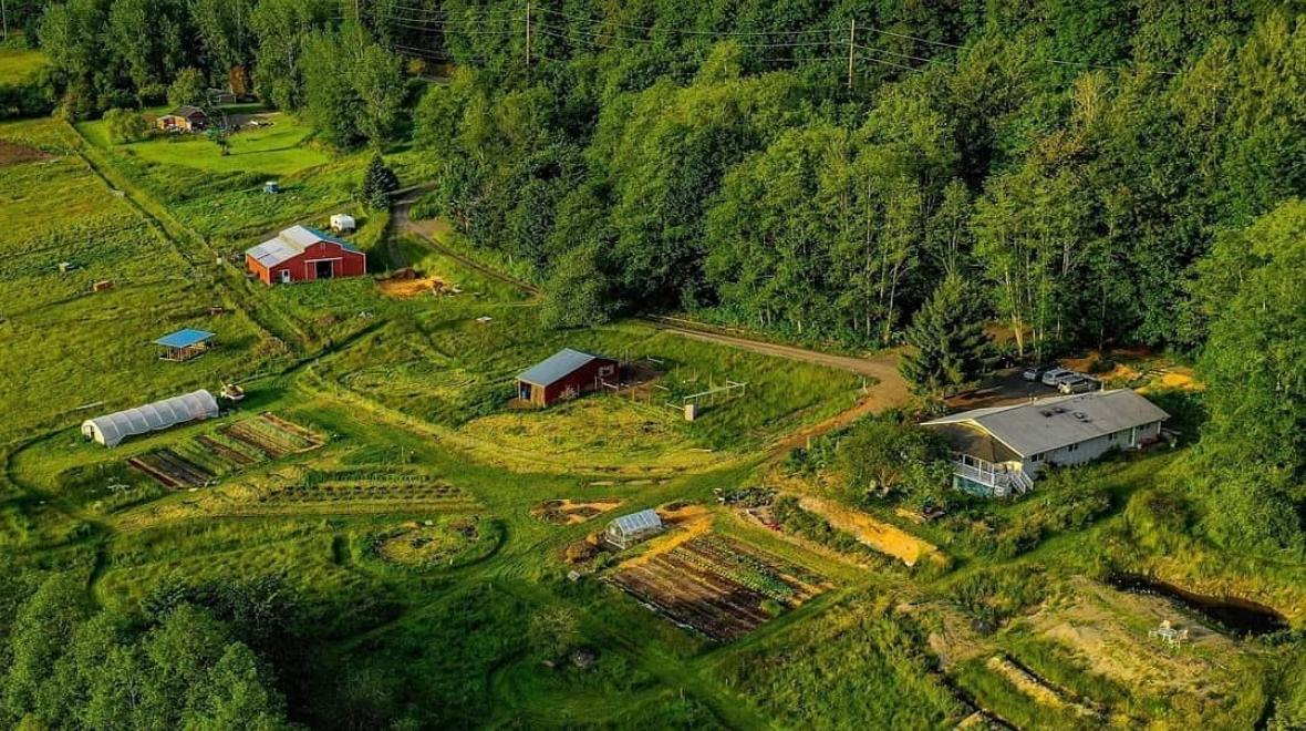 Aerial view of White Lotus Farm & Inn in Port Ludlow, Washington, where families can visit and stay on the farm