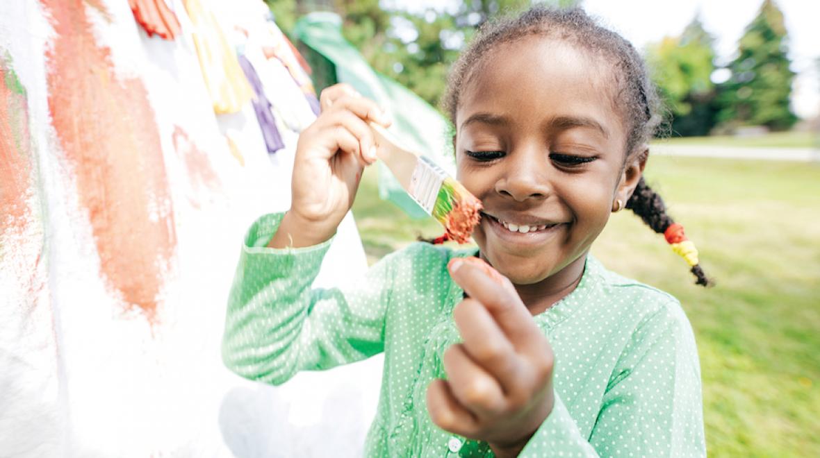 girl painting outside 