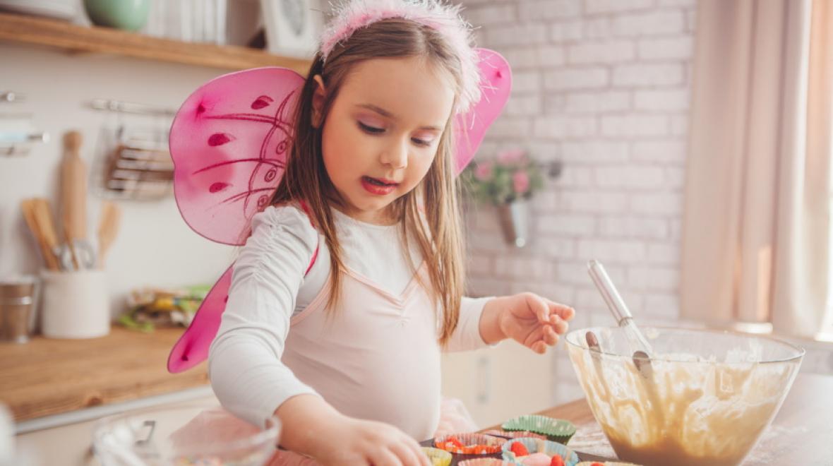 Kid-dressed-as-fairy-making-cakes