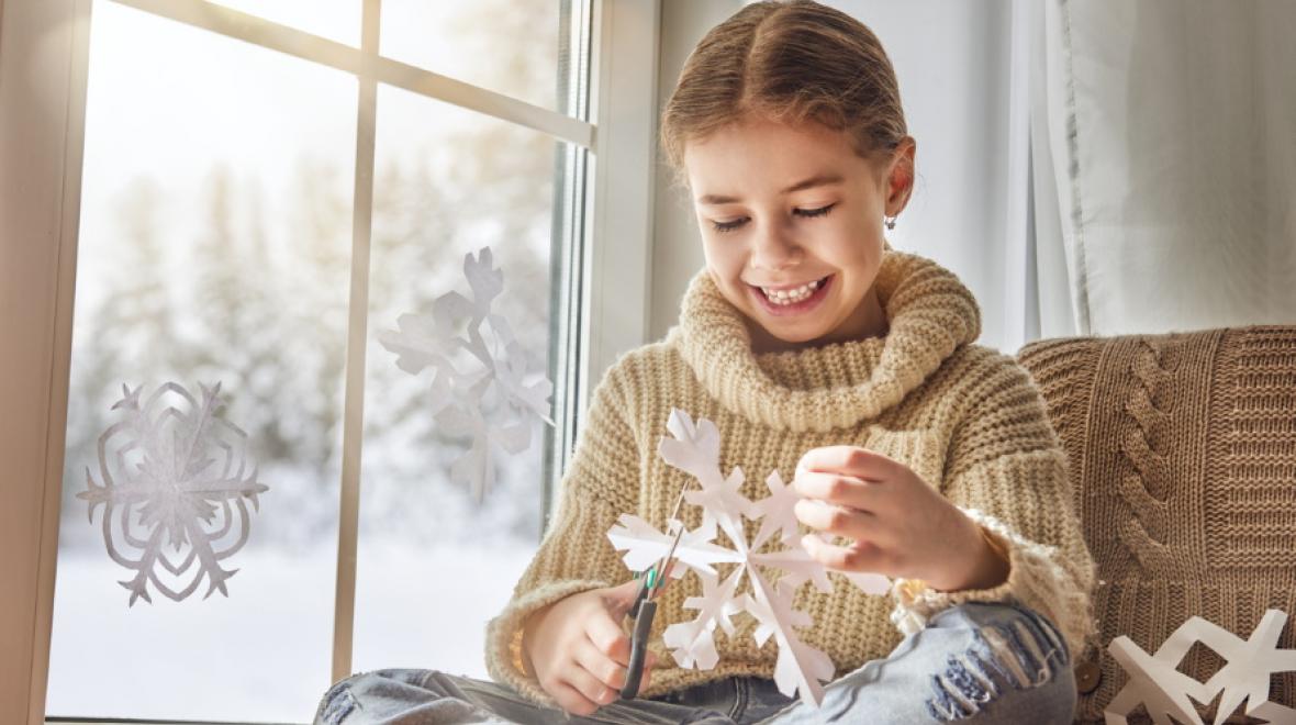 kid-making-paper-snowflake