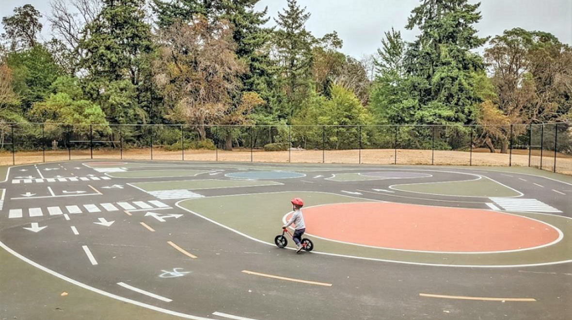 kid riding a bike at White Center Bike playground
