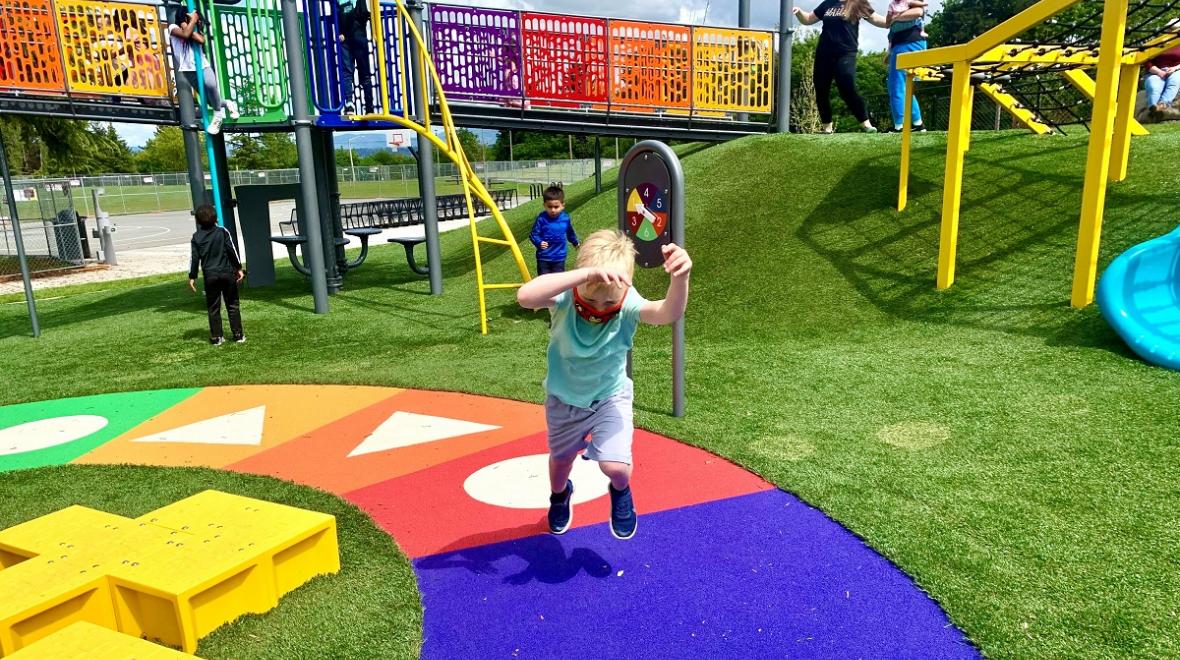 Boy running at new West Fenwick Park Playground