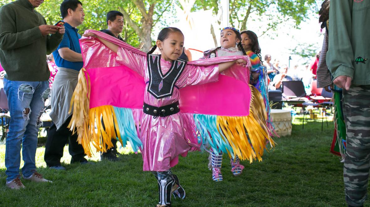 A young Native American girl dances during the Circle of Indigenous People celebration at a past Northwest Folklife Festival