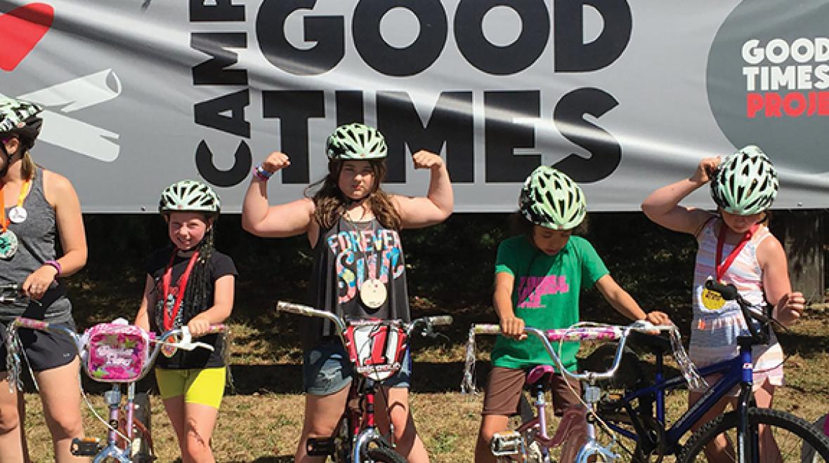 Campers at Camp Goodtimes flex their muscles in a bicycle race