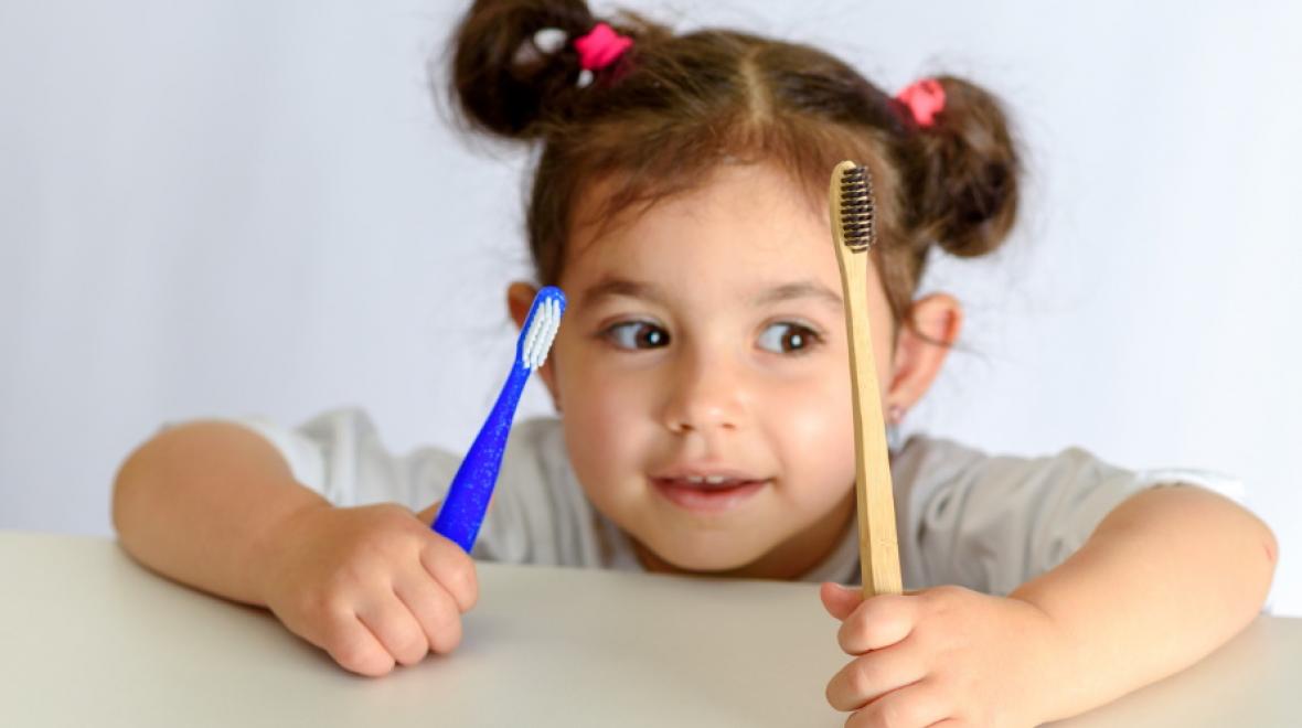 Kid-holding-Bamboo-Toothbrush
