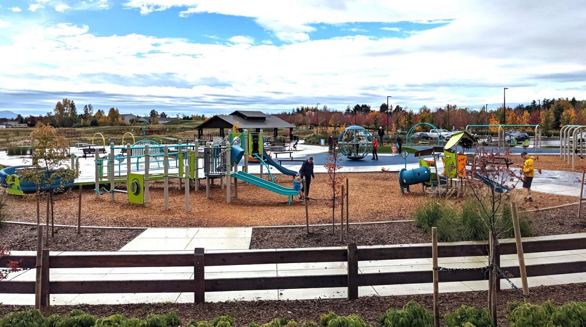 Wide view of the playground at newer Cordata Park on the north side of Bellingham, a smaller city and great getaway destination for Seattle-area families