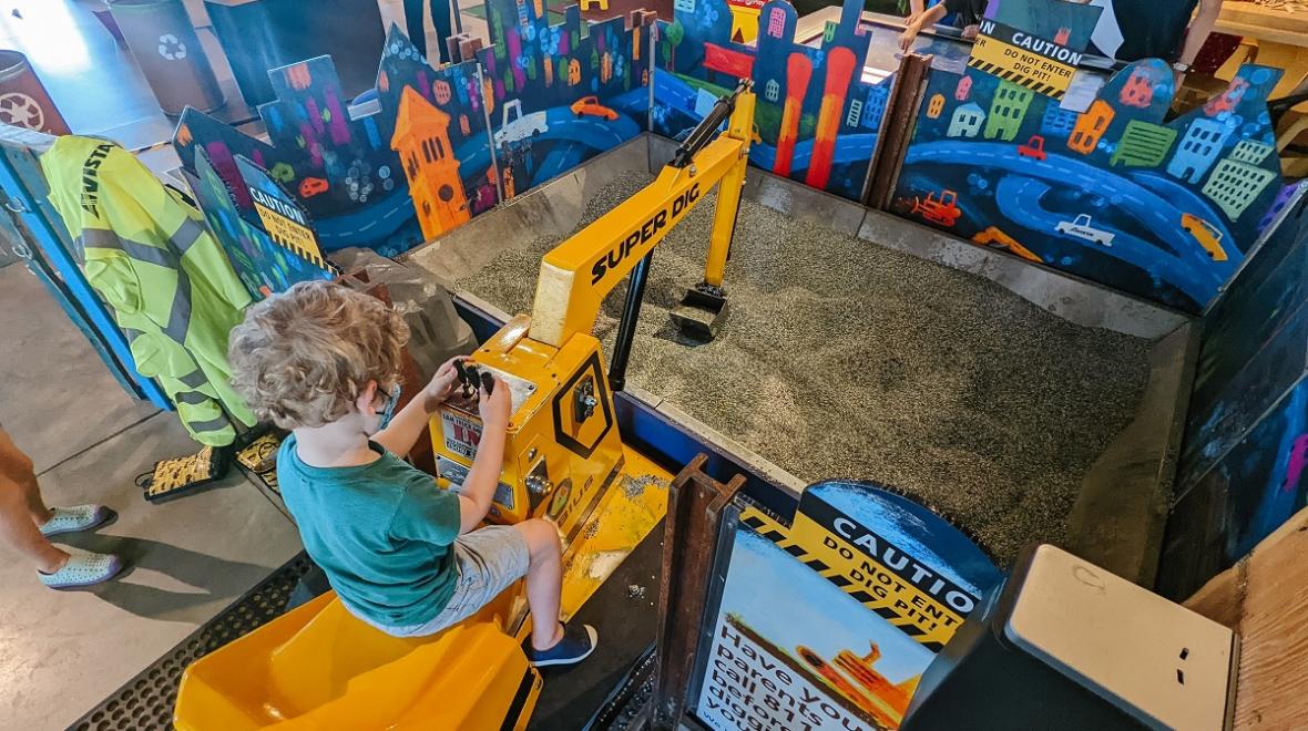 Children playing with a toy digger at Mobius Discovery Center in Spokane, WA.