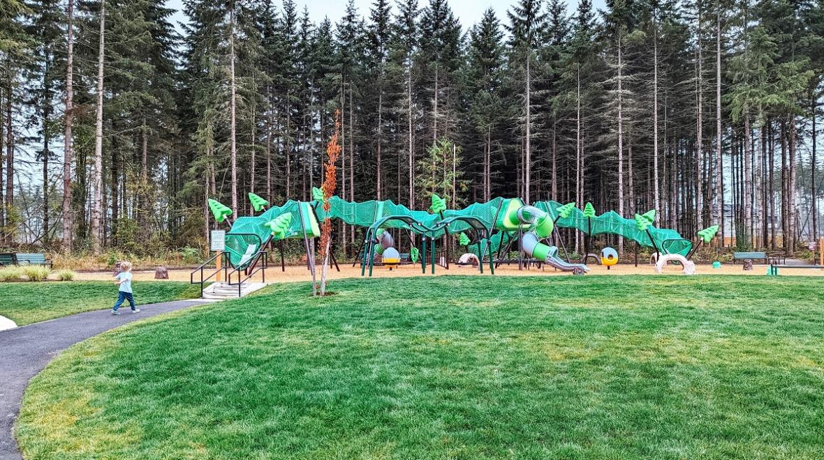 A long tube-shaped net climber is the main feature at a new playground called Hawks Landing found in the community of Tehaleh in Bonney Lake, near Seattle, Wash.