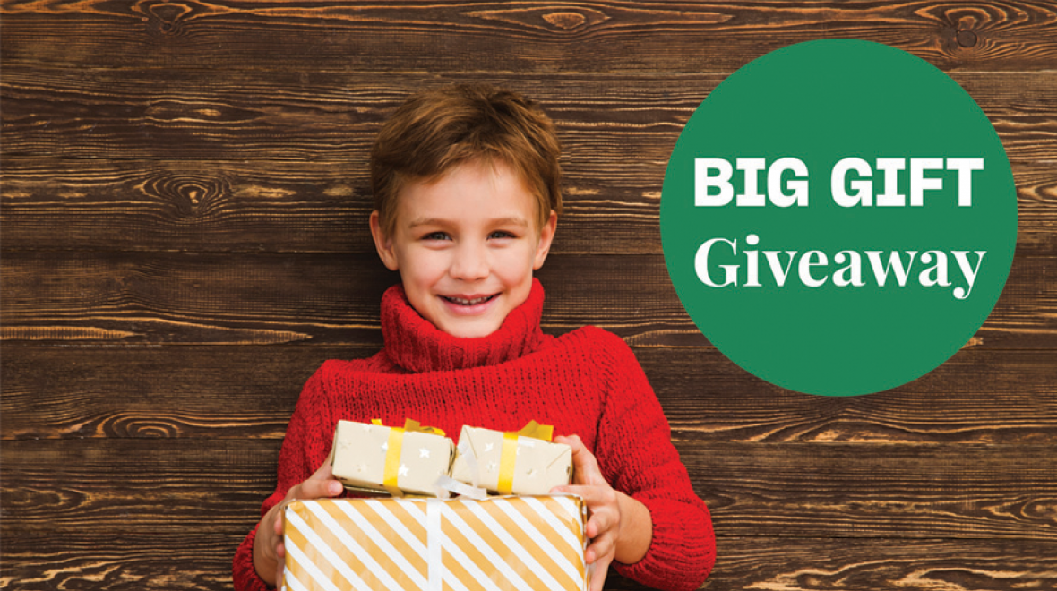 Big Gift Giveaway hero image (child with presents)