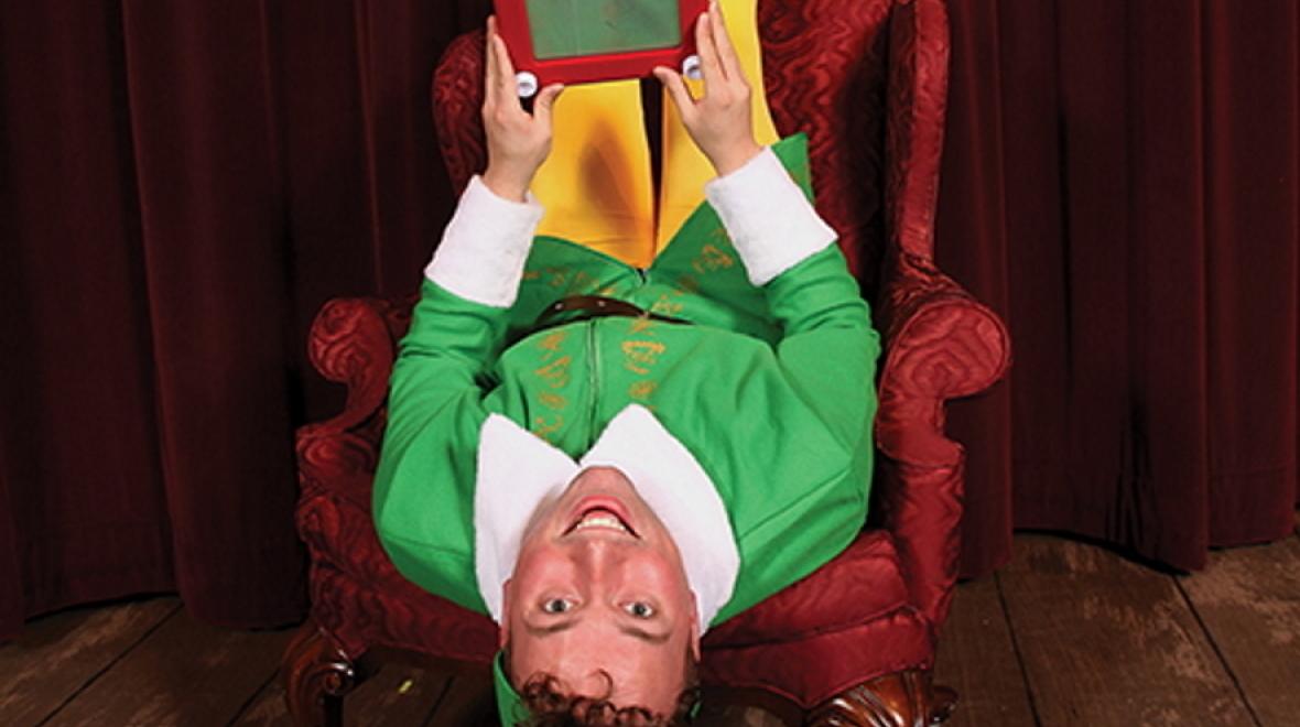 Adult male actor wearing a Buddy the elf costume