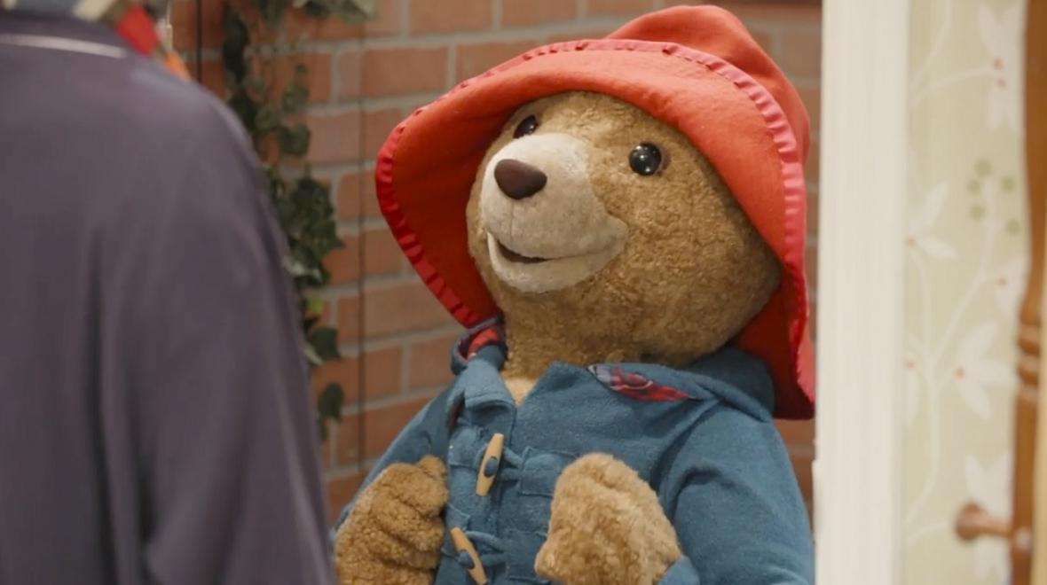 A puppet of Paddington Bear on stage at Seattle Children's Theatre's production of "Paddington Saves Christmas" 2022 season holiday show review from ParentMap