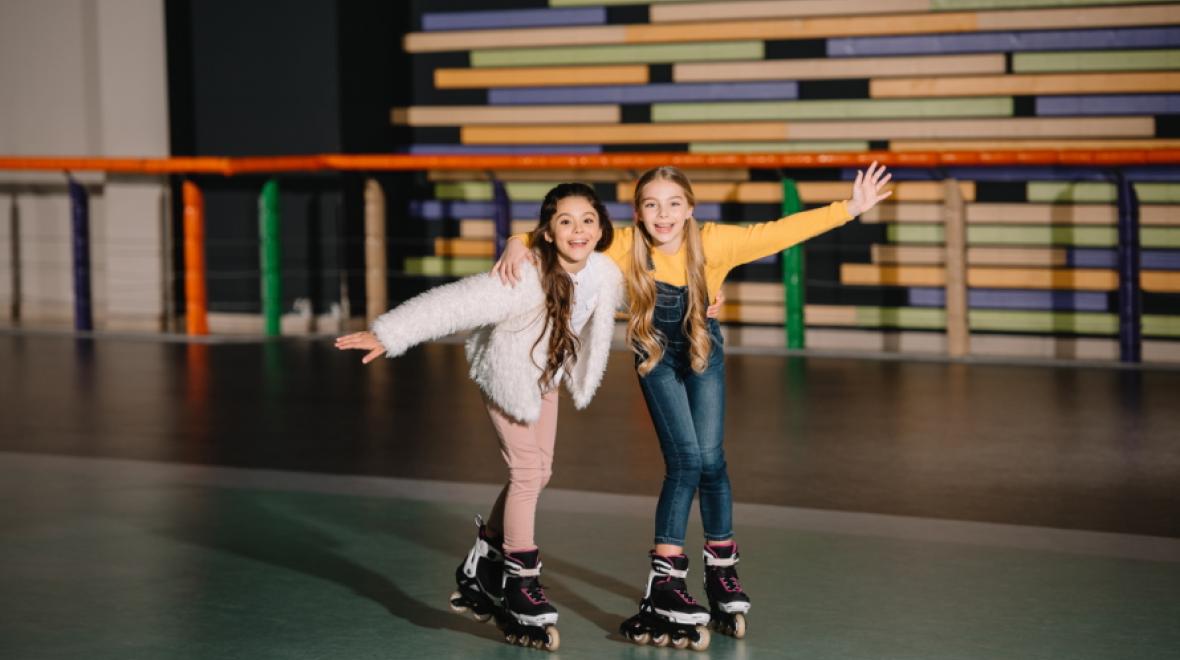 Two tween girls roller skating
