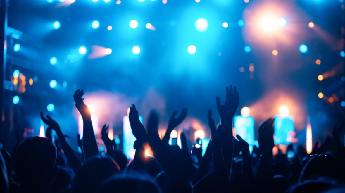 Hands raised at a concert