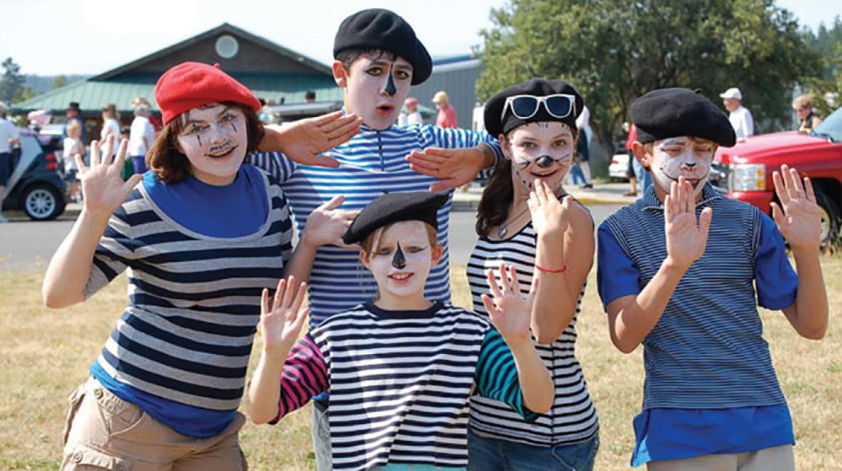 Group of kids with mime face paint