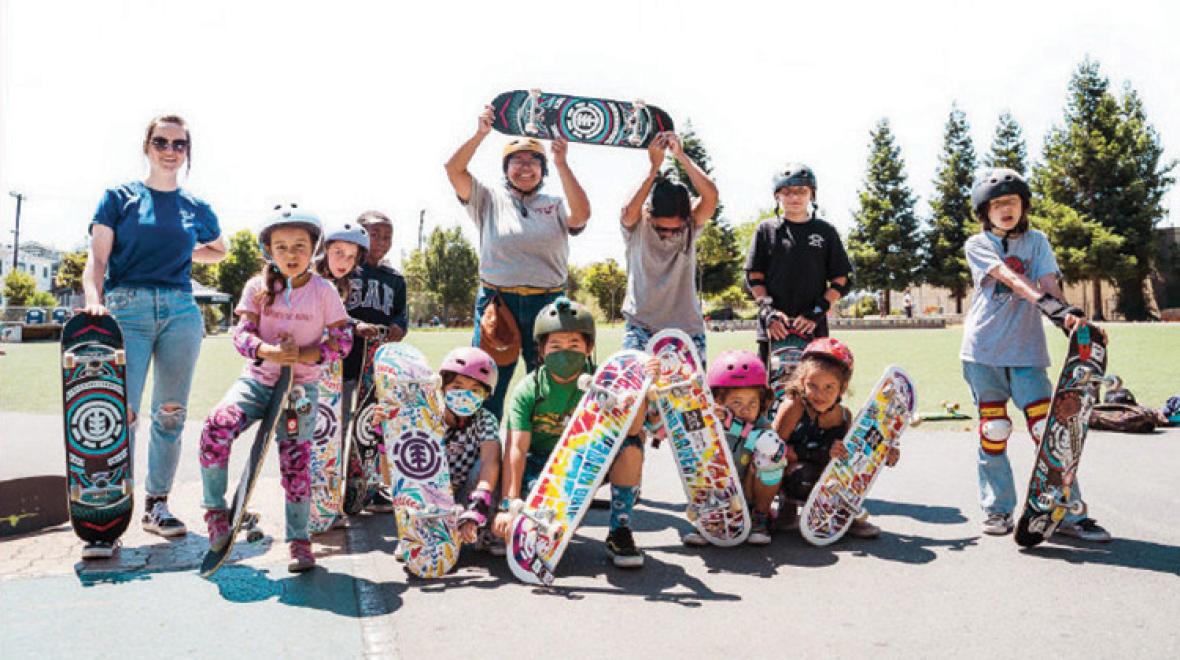 Group of kids holding skateboards