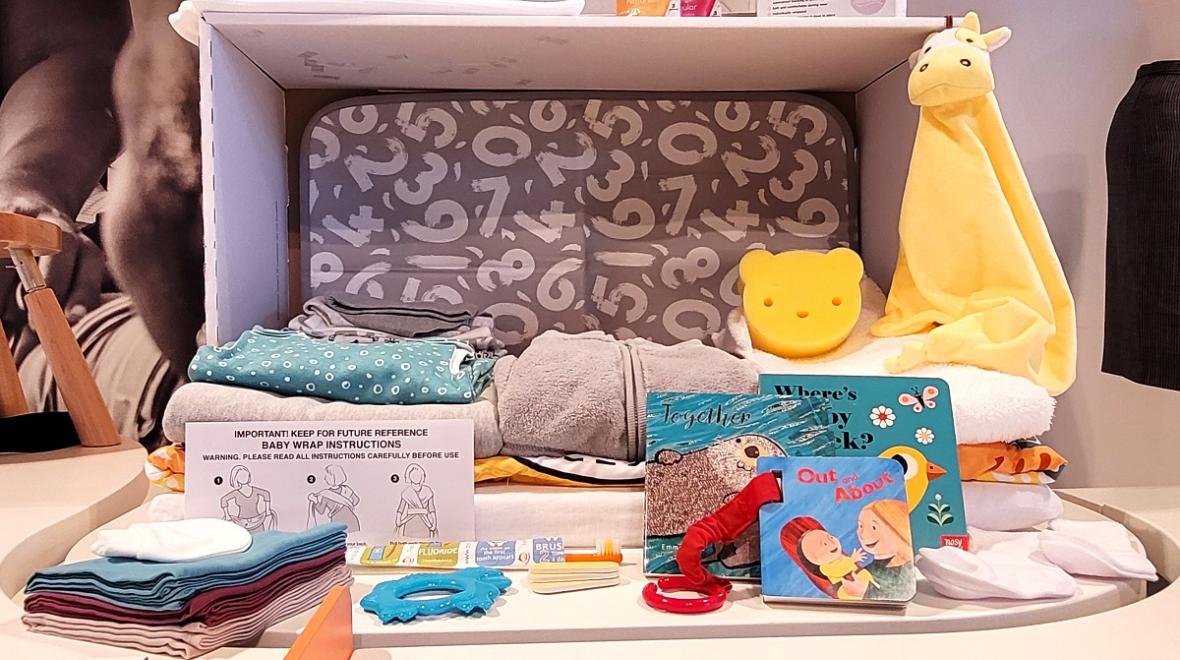 A Finnish "baby box" given to new parents in Finland is on display at Seattle's Gates Foundation Discovery Center new exhibit called Designing Motherhood, things that make and break our births