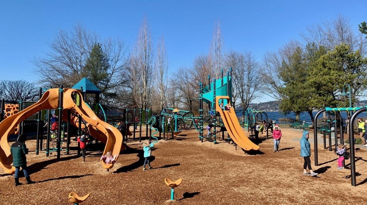 View of the colorful updated playground at Renton’s Gene Coulon Memorial Beach Park near Seattle, among the best most adventurous playgrounds for kids