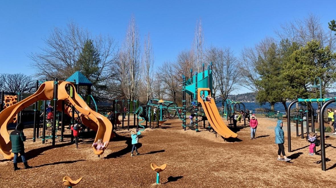 View of the colorful updated playground at Renton's Gene Coulon Memorial Beach Park near Seattle, among the best most adventurous playgrounds for kids