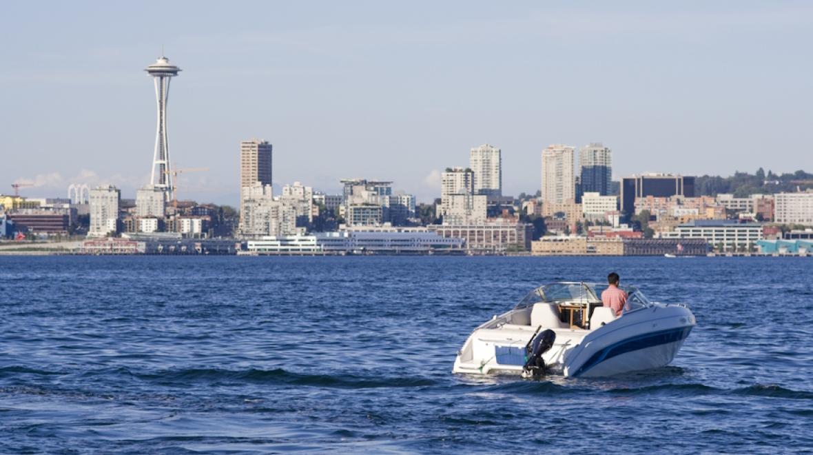 Motor boat in Puget sound with the Space Needle in the background 