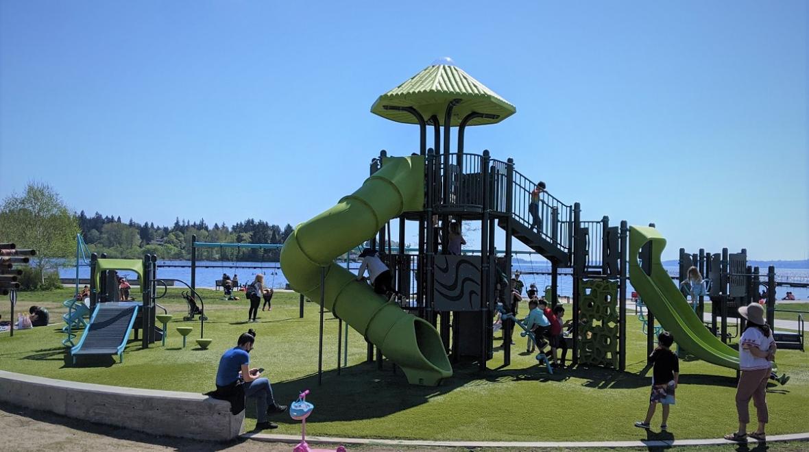 The swimming beach at Juanita Beach Park in Kirkland near Seattle is right next to a super fun updated playground