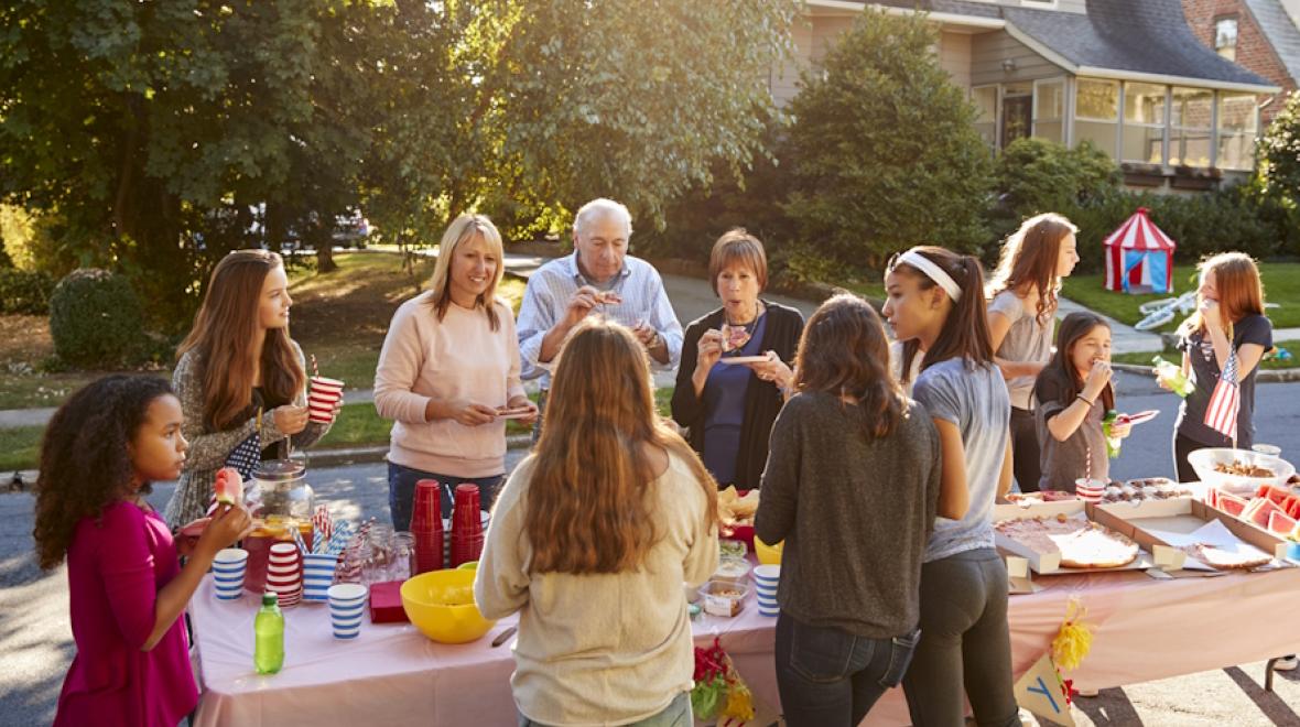 group of people eating at a block party