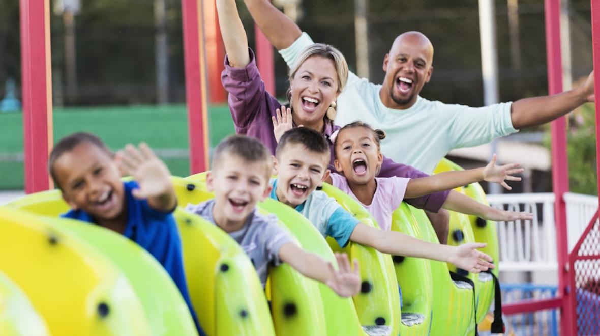 Family having fun on a theme park ride