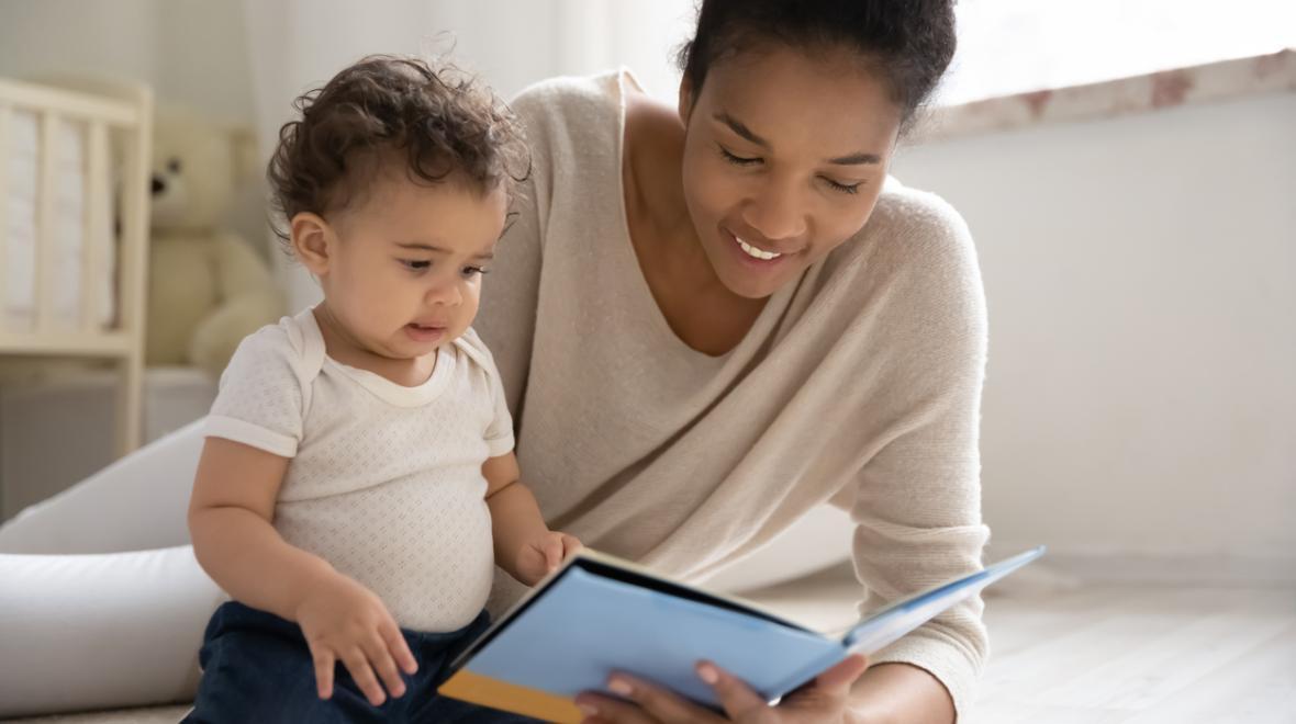 mom and baby reading a book