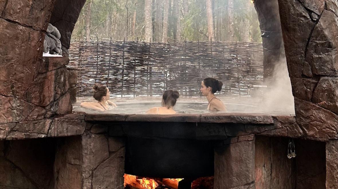 Three women in a hot tub at Paradise Village