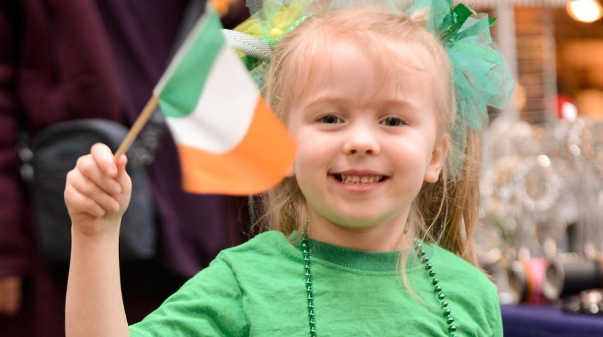 girl waving flag at Irish Festival