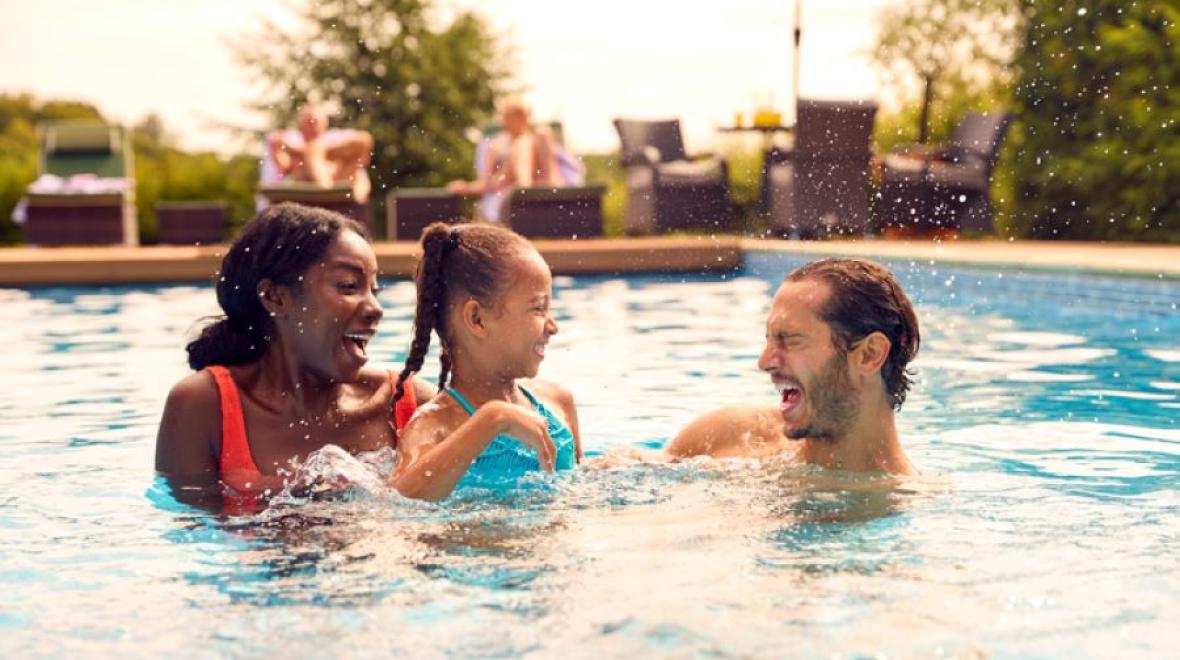 a family in a pool using a seattle hotel pass as a way to access this amenity