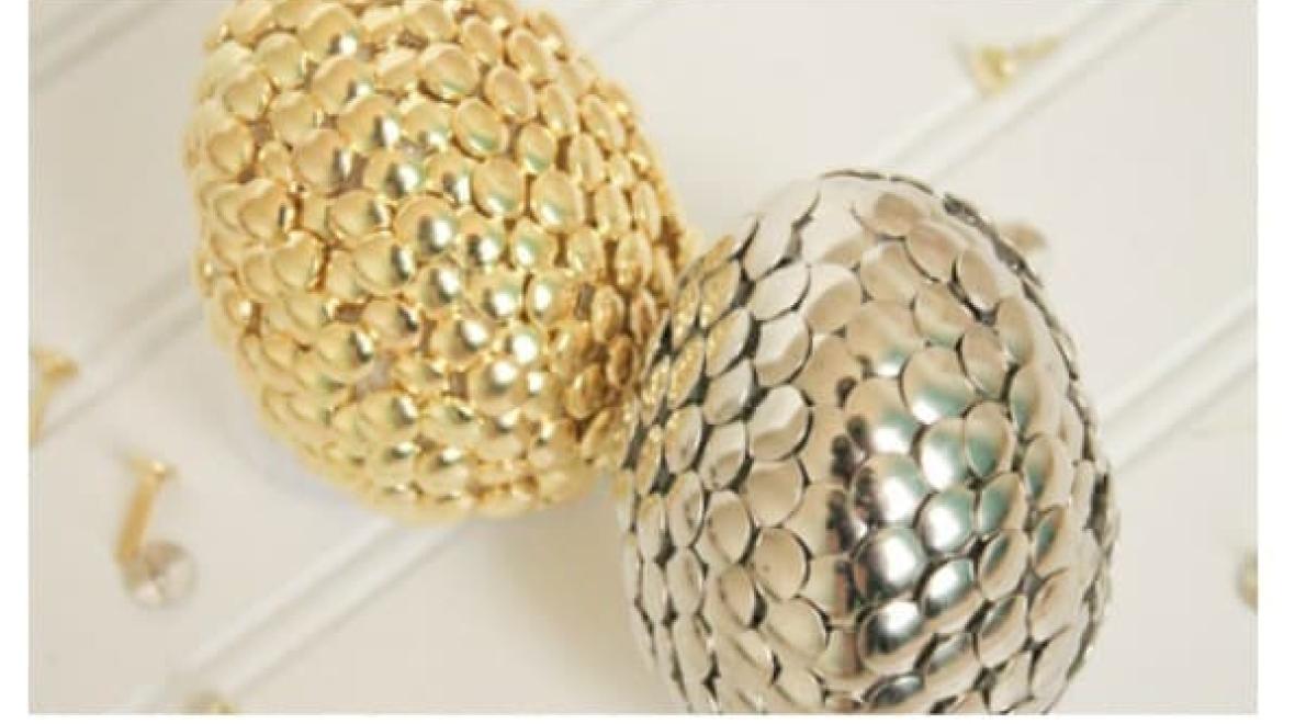 Eggs covered in gold and silver thumb tacks are a simple Easter egg idea for kids