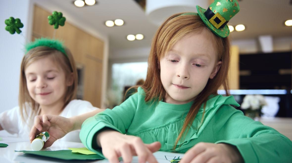 two girls making St. Patrick's Day treats and leprechaun traps 