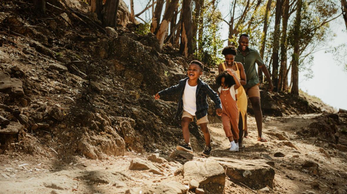 Black family hiking a local trail during spring break