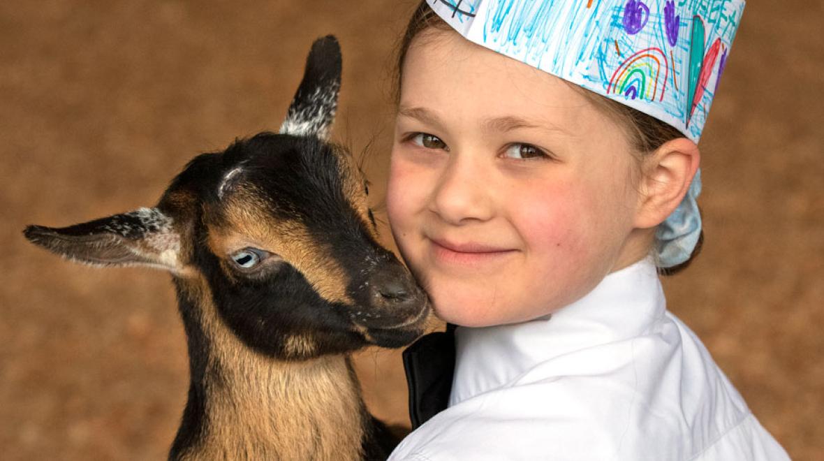 girl and goat at Washington State Spring Fair during spring break