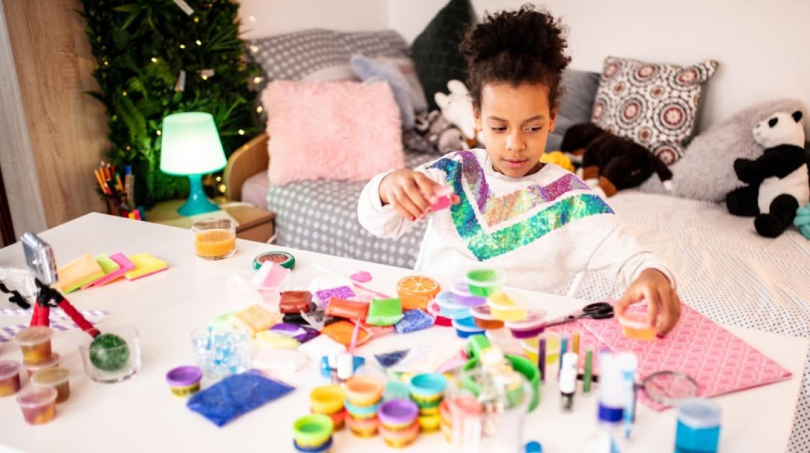 Young girl making slime spring break at home