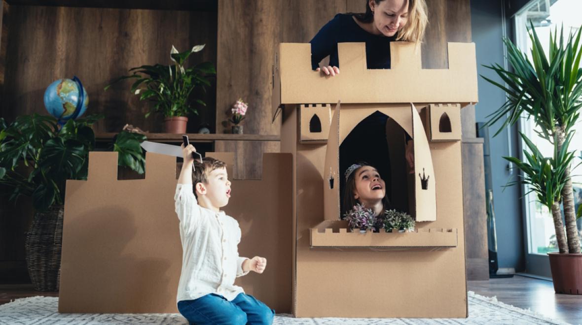 mom and kids getting active and creative with cardboard at home