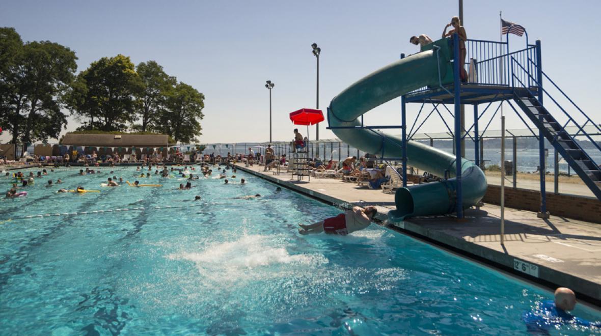 Sliding down the waterslide at Colman pool is a fantastic Seattle swimming pool activity on a sunny day