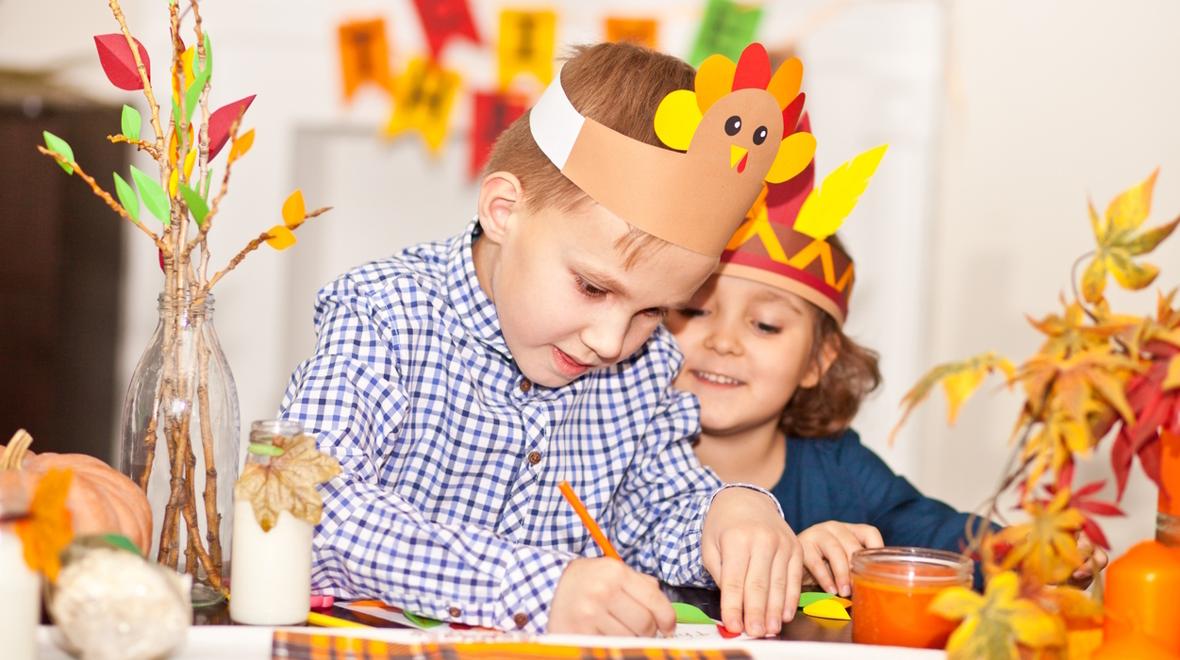 Kids working on a Thanksgiving craft project