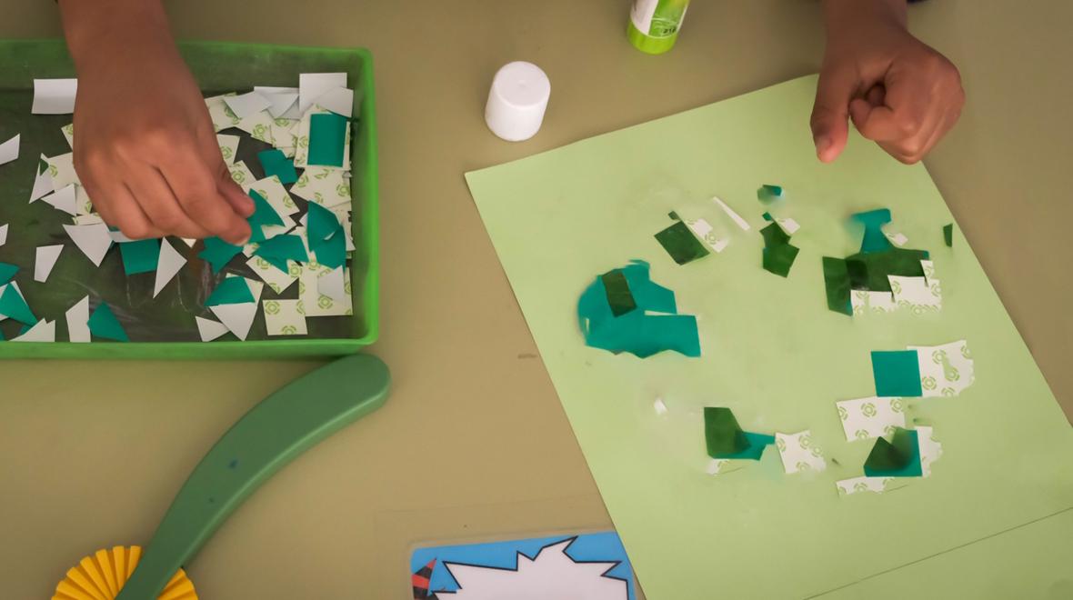 child working on a shamrock mosaic