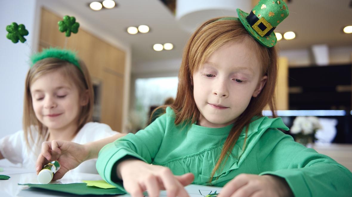 two girls working on St. Patrick's Day crafts