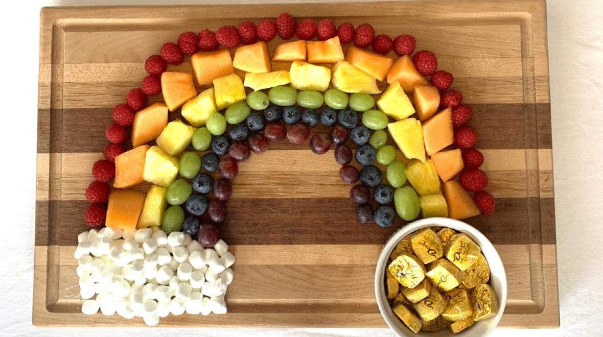 fruit arranged in the shape and colors of a rainbow