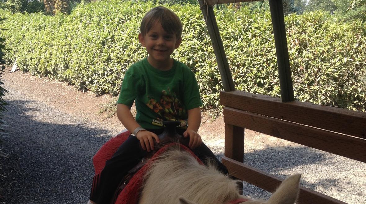 taking a pony ride at Remlinger farms