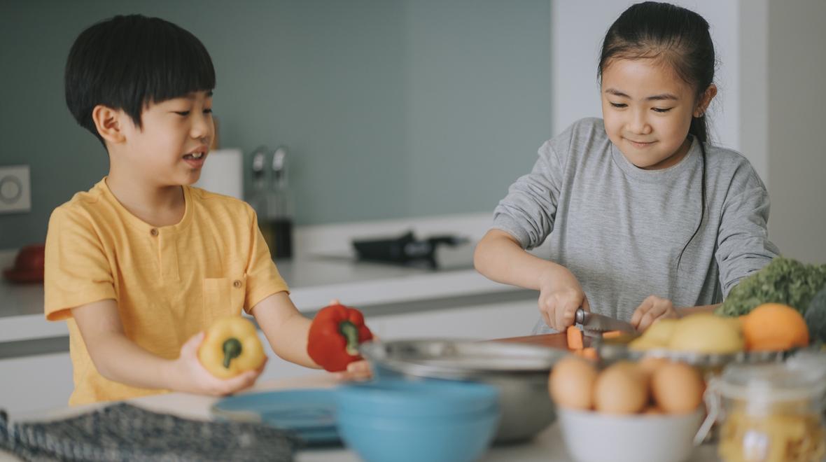 Kids cooking at home during summer vacation