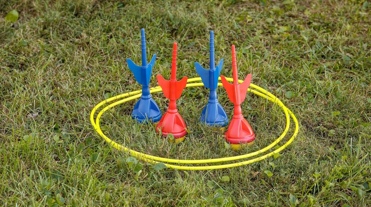 lawn darts and a yellow hoop to aim at