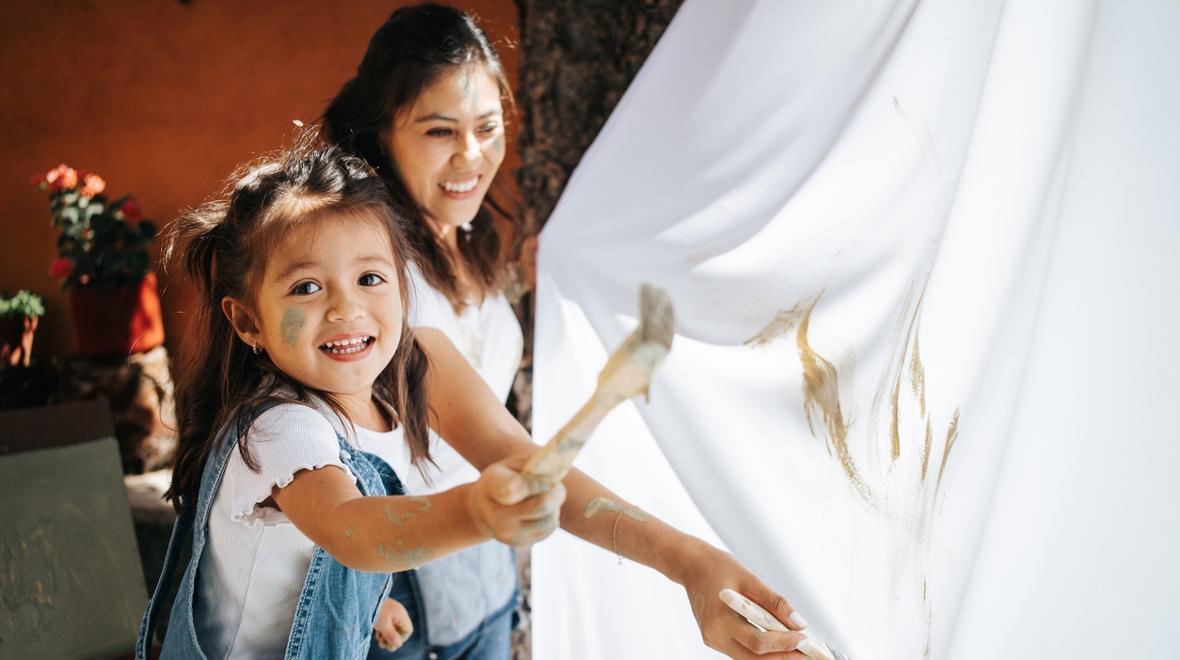 child painting on a shower curtain