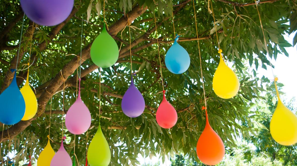 water balloons hanging from a tree
